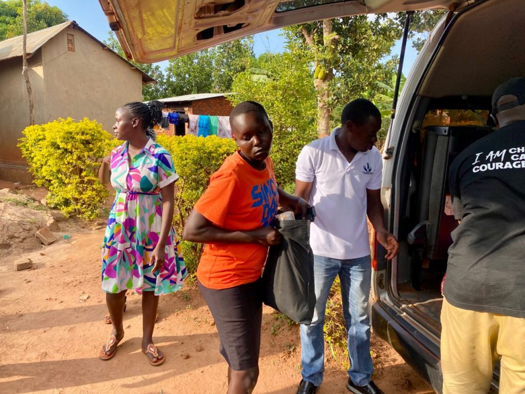 Foundation volunteers unloading Christmas packages from a vehicle