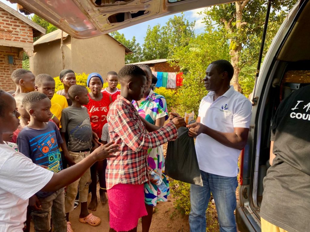 Receiving a black Christmas package from a Foundation representative
